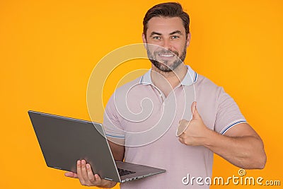 Business man working on laptop in studio. Man checking email on laptop, writing message in social network, using Stock Photo