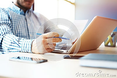 Business man working at office with laptop and documents on his desk Stock Photo