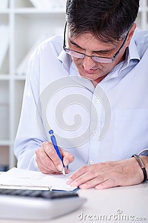 Business man writing note Stock Photo