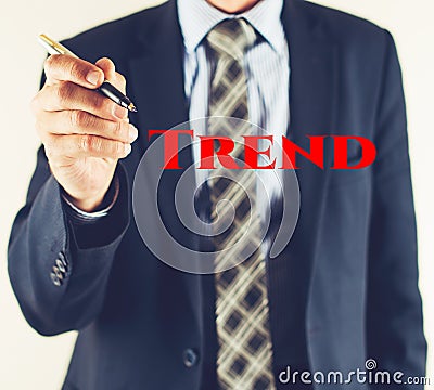 Business man writing TREND text, business concept Stock Photo