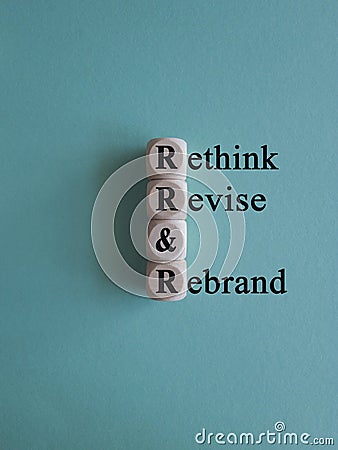 Business management branding concept of rethink revise and rebrand words on wooden cubes. Stock Photo