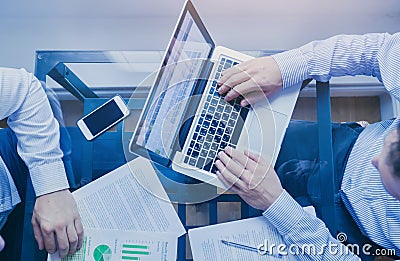Business management, top view of hands of businessmen working on computer Stock Photo
