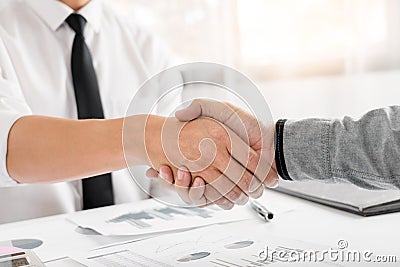 Business Meeting agreement Handshake concept, Hand holding after finishing up dealing project or bargain success at negotiation Stock Photo