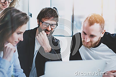 Business meeting concept.Coworkers team working with mobile computer at modern office.Analyze business plans,using Stock Photo