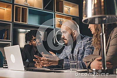 business meeting. Discussion of the start-up of the project. Young multiracial programming team Stock Photo