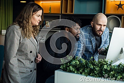 business meeting. Discussion of the start-up of the project. Young multiracial programming team Stock Photo