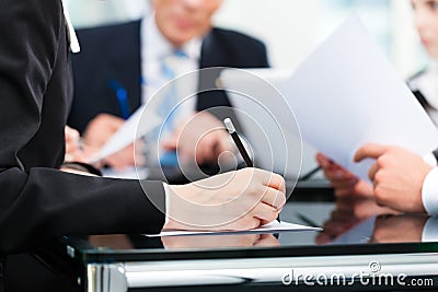 Business meeting with work on contract Stock Photo