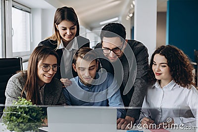 Business meeting, Young coworker team making great business discussion with computer in co-working office. Teamwork people concept Stock Photo