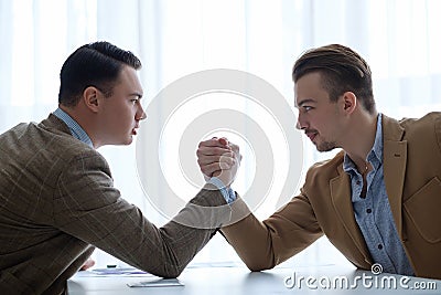 Business face off arm wrestling leader competition Stock Photo