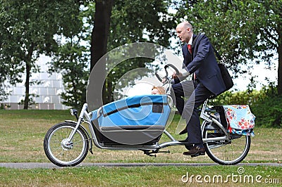 Business men hurrying to the childï¿½s creche Stock Photo