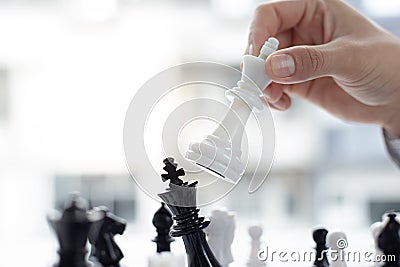 Business men make plans to play chess with Prudence and success Stock Photo