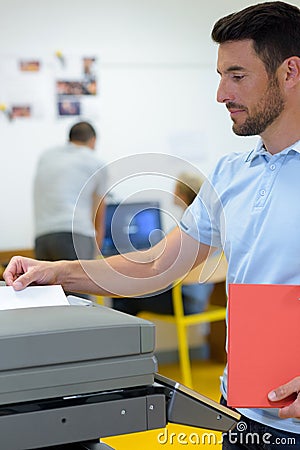 Business man making photocopy at photocopier Stock Photo