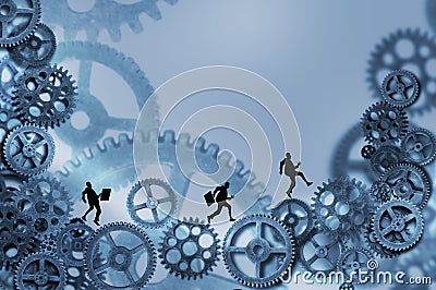 Business men running on gears Stock Photo