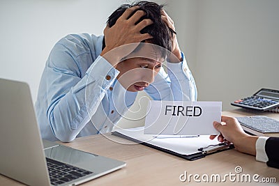 Business men are shocked and stressed The executive sent a letter to dismiss from the job. Business bankruptcy Stock Photo