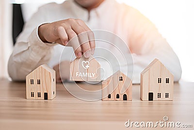 Business men are thinking choosing a home family frist Stock Photo
