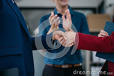 Business men and women shake hands confidently professional investor working with new startup project at an office meeting Stock Photo