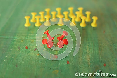 Business metaphor,solution,innovation,idea,consulting, human resources concept with row of drawing pins, some red ones breaking Stock Photo