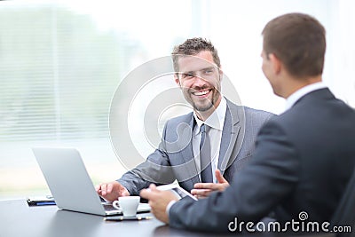 Business negotiations. Two colleagues talking in the office. Stock Photo