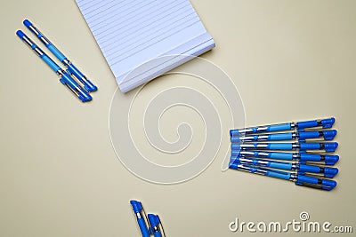 Business, office, student, education flat lay, table top. Notepad, pens placed creatively on yellow background Stock Photo