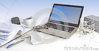 Business office workspace, laptop, cell phone, glasses and paper Stock Photo