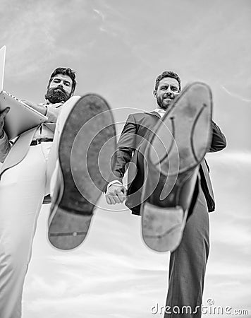 Business partner busy with phone call moving forward, foot shoe close up. Businessmen making step bottom view. Business Stock Photo