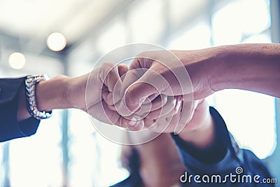 Business partner people joining and stack hand together after contract finished meeting. Stock Photo