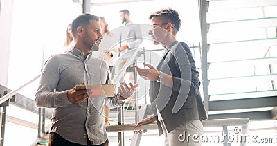 Business colleagues having conversation during coffee break Stock Photo