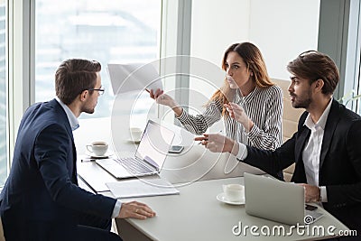 Business partners disagree with company CEO on contract terms Stock Photo