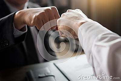 Business Partners Giving Fist Bump to commitment Greeting Start Stock Photo