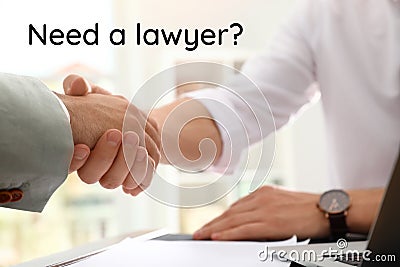 Business partners shaking hands at table in office. Need a lawyer Stock Photo