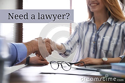 Business partners shaking hands at table in office. Need a lawyer Stock Photo