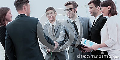 Investor and CFO in the presence of a business team shake hands Stock Photo