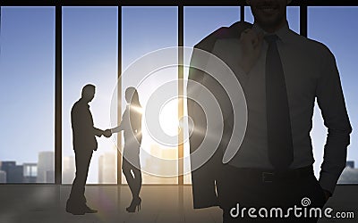 Business partners silhouettes shaking hands Stock Photo