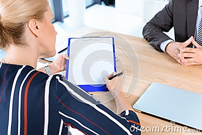 Business partners writing contract Stock Photo