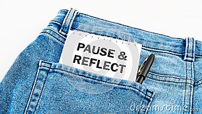 Business and Pause and Reflect concept. Copy space. Pause and Reflect symbol on a notebook on jeans on a white background Stock Photo