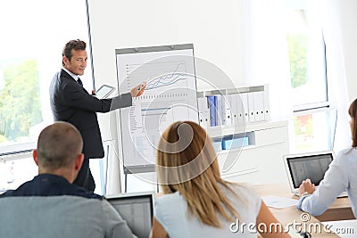 Business people attending business presentation Stock Photo