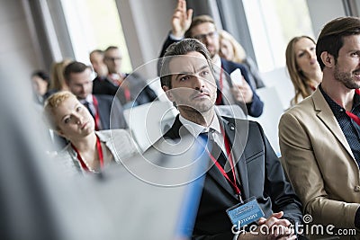 Business people attending seminar at convention center Stock Photo