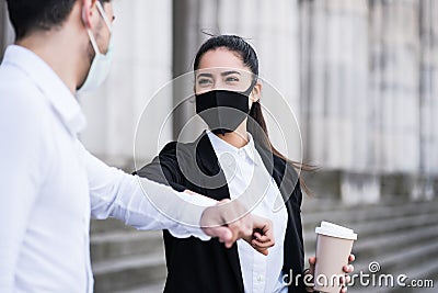 Business people bumping elbows for greeting each other. Stock Photo