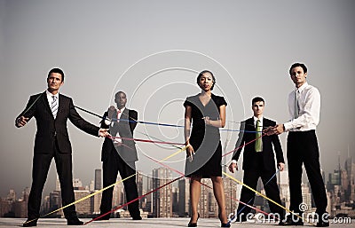 Business People Connected By Strings Stock Photo