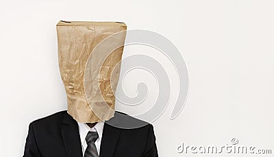 Business people with crumpled brown paper bag on head, with copy space Stock Photo