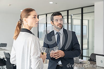 Business people drinking champagne to celebrate success. Stock Photo