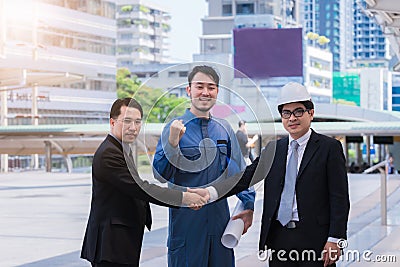 Business people engineer shaking hands,Teamwork finishing up a meeting partners greeting each other after signing contract Stock Photo
