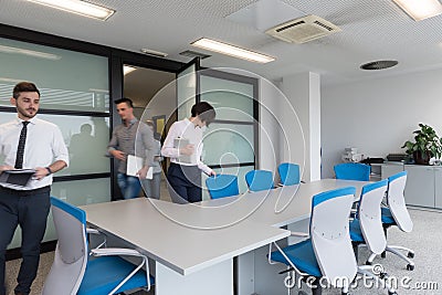 Business people group entering meeting room, motion blur Stock Photo