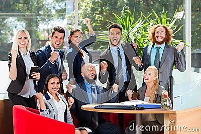 Business People Group Sit At Desk, Successful Excited Team In Modern Office, Businesspeople Happy Smile With Raised Stock Photo