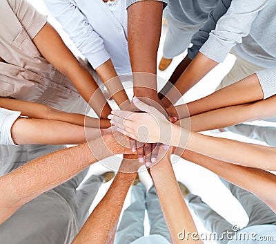 Business people-hands overlapping to show teamwork Stock Photo