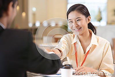 Business people handshake in modern office. Greeting deal concept Stock Photo