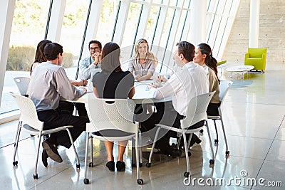 Business People Having Board Meeting In Modern Office Stock Photo