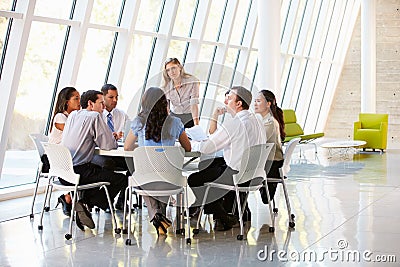 Business People Having Board Meeting In Modern Office Stock Photo