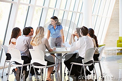 Business People Having Board Meeting In Modern Office Stock Photo