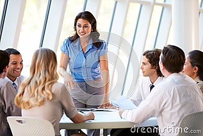 Business People Having Board Meeting In Modern Office Stock Photo